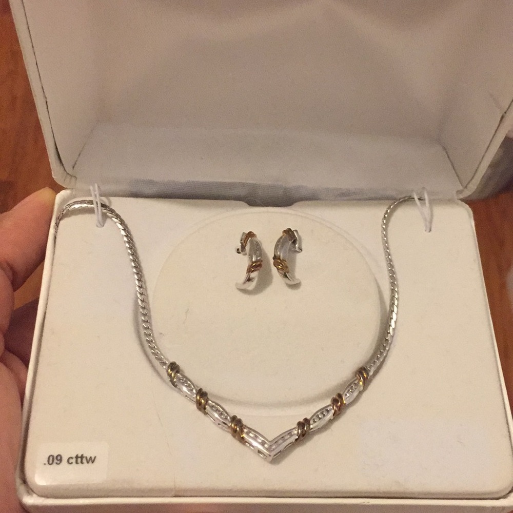 Earrings and a silver necklace w/ bronze accents